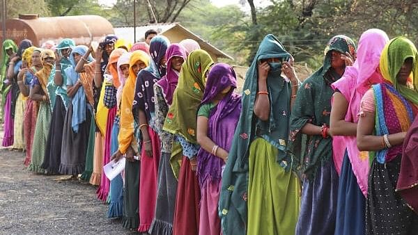 <div class="paragraphs"><p>Women wait in a long queue to cast their votes at a polling booth during the fourth phase of General Elections-2024 in Jhabua district, Madhya Pradesh.</p></div>