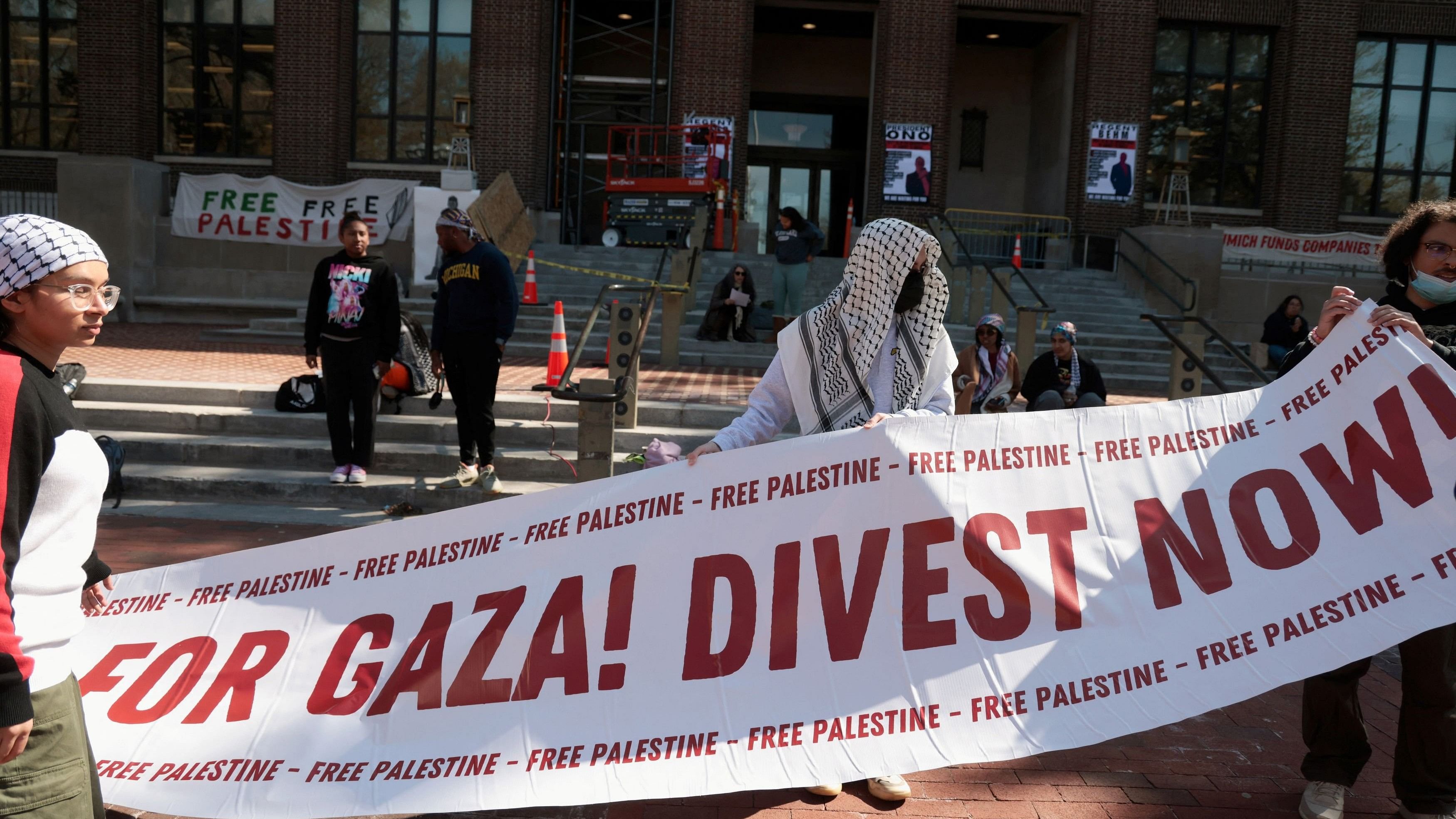 <div class="paragraphs"><p>Protesters hold a banner as a coalition of University of Michigan students camp at an encampment in the Diag to pressure the university to divest its endowment from companies that support Israel or could profit from the ongoing conflict between Israel and Hamas on the University of Michigan college campus in Ann Arbor, Michigan, US, April 25, 2024.  </p></div>