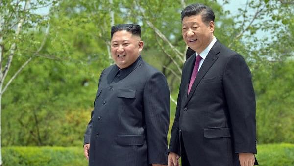 <div class="paragraphs"><p>(L to R) North Korean leader Kim Jong Un with Chinese President Xi Jinping and </p></div>