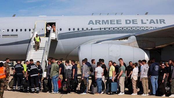 <div class="paragraphs"><p>Civil guards, police officers and sailors firefighters line up as they board a plane of the French Air Force at Istres military airbase after France declared a state of emergency to regain control of events in New Caledonia, near Marseille, France, May 16, 2024.</p></div>