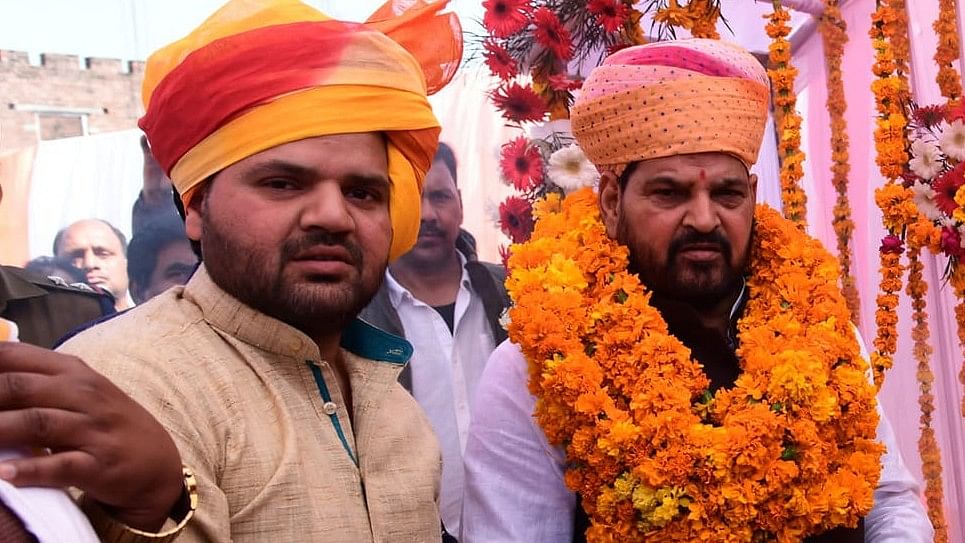 <div class="paragraphs"><p>Kaiserganj MP&nbsp;Brij Bhushan Singh with his son&nbsp;Karan Bhushan Singh.</p></div>