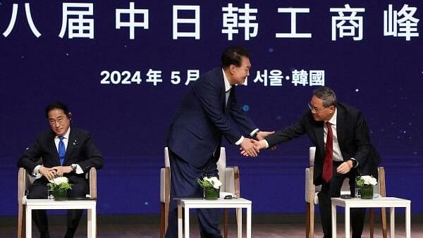 <div class="paragraphs"><p>Japanese Prime Minister Fumio Kishida, South Korean President Yoon Suk Yeol and Chinese Premier Li Qiang attend the business summit at the Korea Chamber of Commerce and Industry on May 27.</p></div>