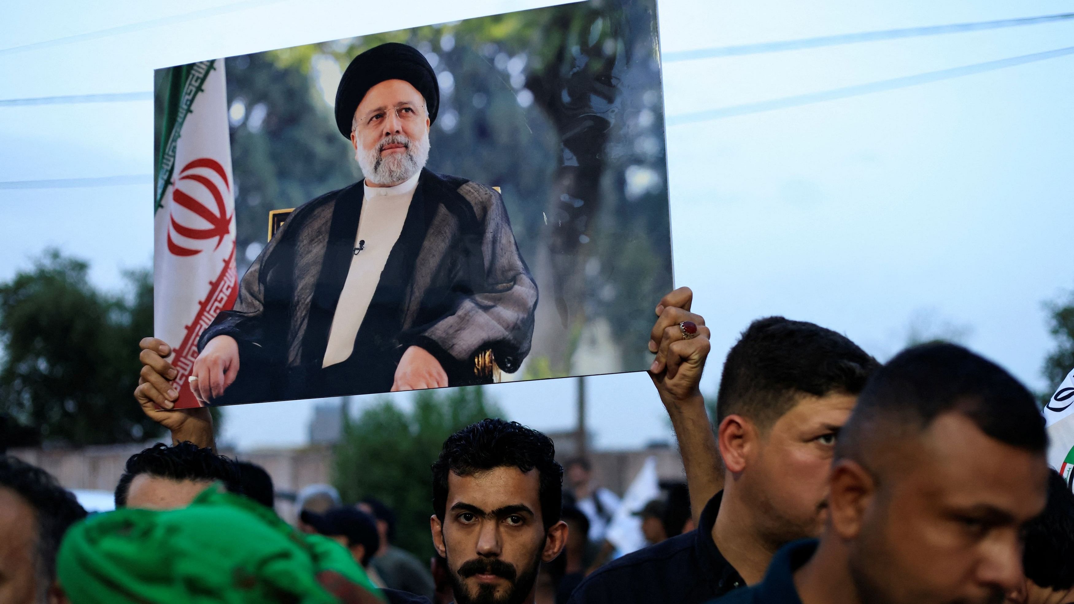 <div class="paragraphs"><p>Supporters of Iraqi Popular Mobilization Forces offer condolences over the deaths of Iran's President Ebrahim Raisi and others, outside the Iranian embassy, in Baghdad,Iraq May 20, 2024</p></div>