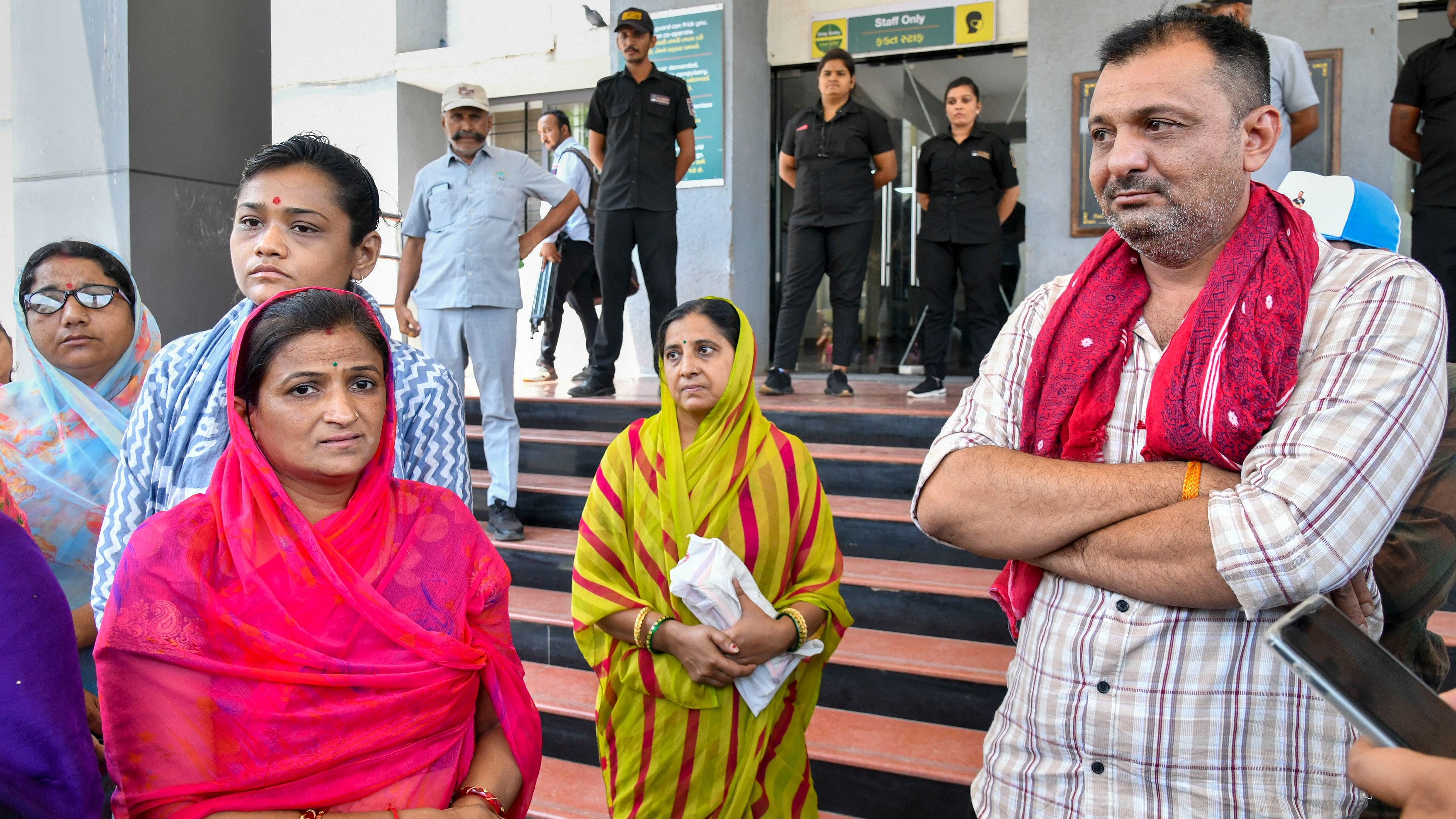 <div class="paragraphs"><p>Family members wait to receive the body of a victim of gaming zone fire outside a mortuary, in Rajkot, on Sunday.</p></div>