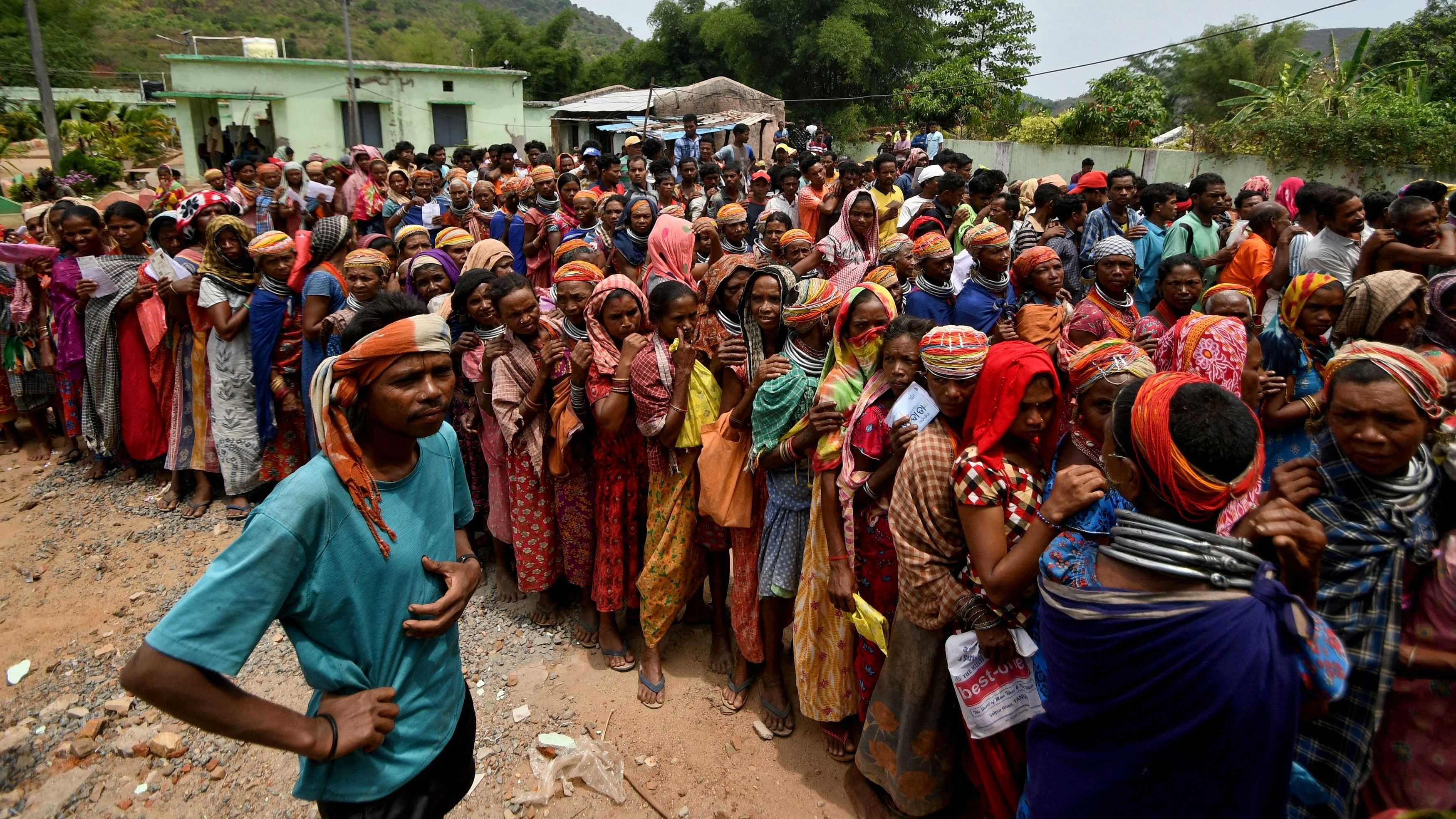 <div class="paragraphs"><p>People stand in a queue to vote in Odisha, May 13, 2024.</p></div>