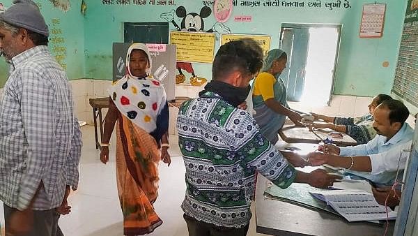 <div class="paragraphs"><p> People cast their votes in Amreli. File photo.</p></div>