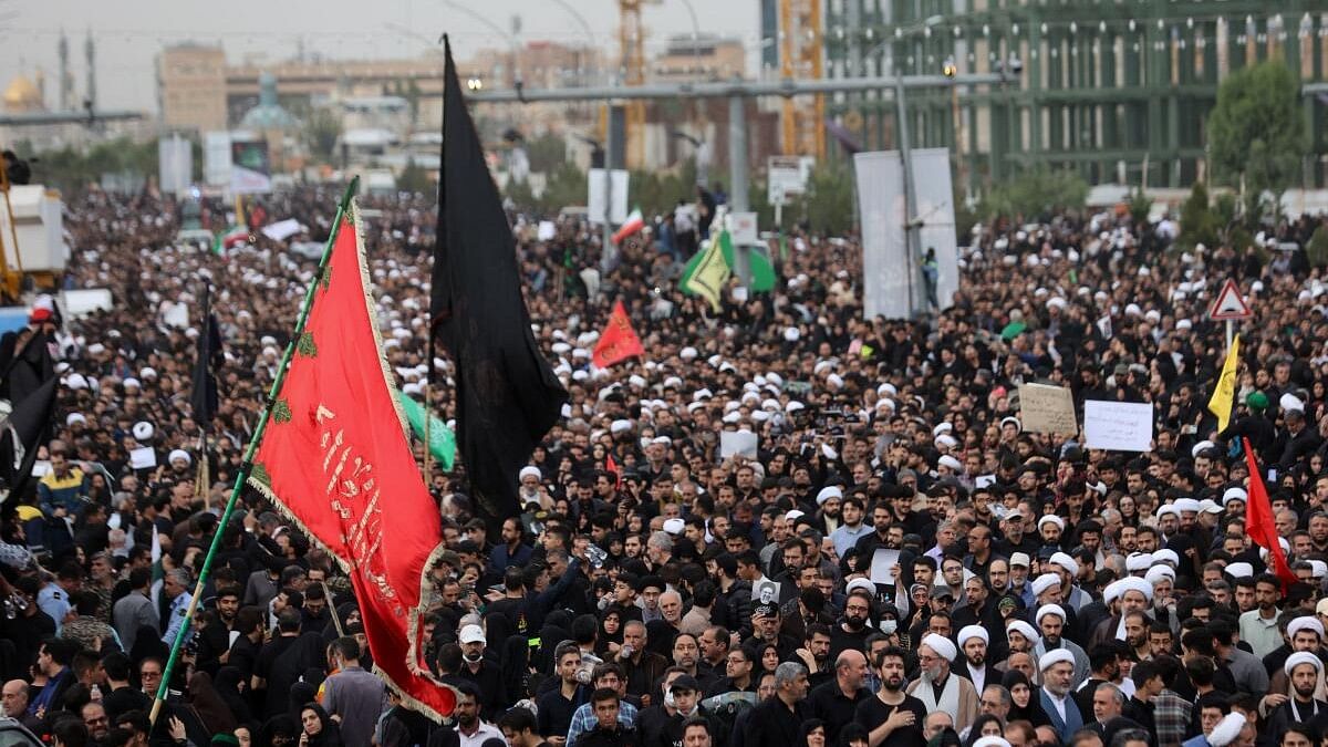 <div class="paragraphs"><p>People attend a funeral procession for the late Iranian President Ebrahim Raisi, Foreign Minister Hossein Amirabdollahian and six other passengers and crew who were killed following a helicopter crash, in Qom, Iran.</p></div>