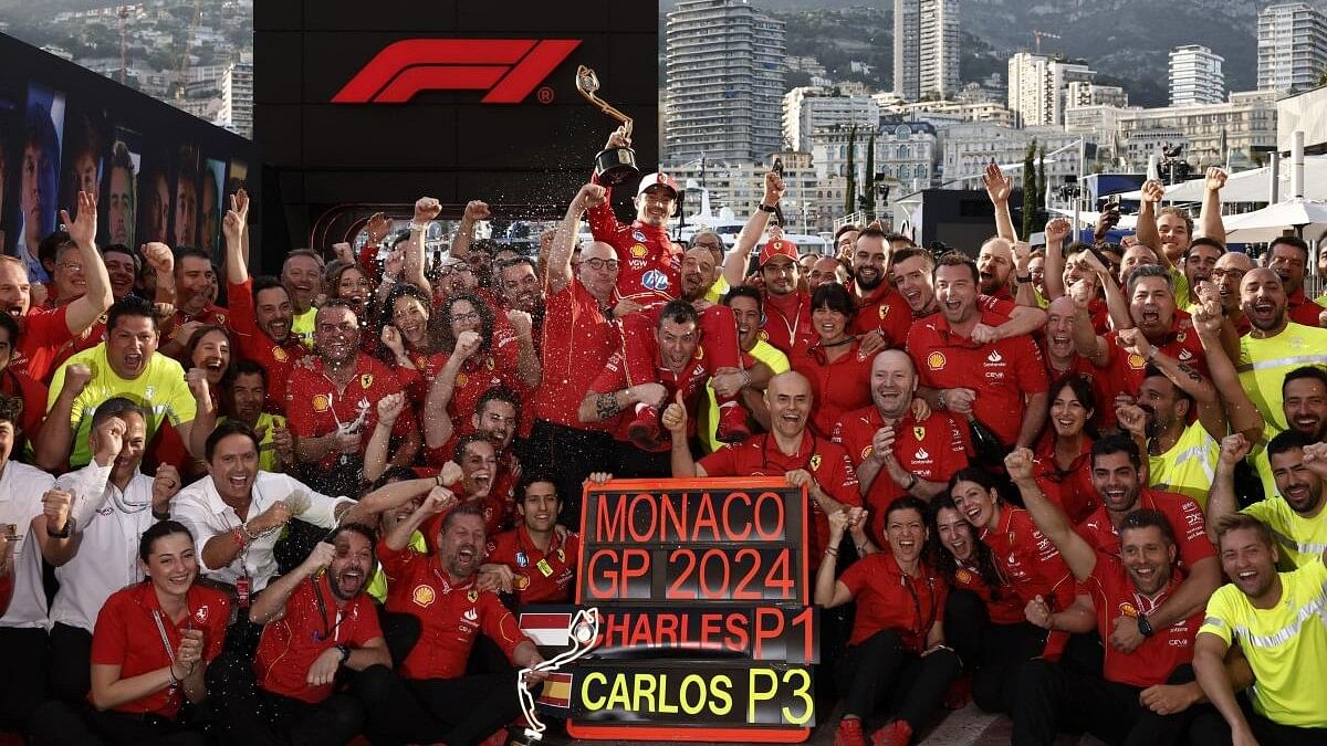 <div class="paragraphs"><p>Ferrari's Charles Leclerc celebrates with team members after winning the Monaco Grand Prix.</p></div>