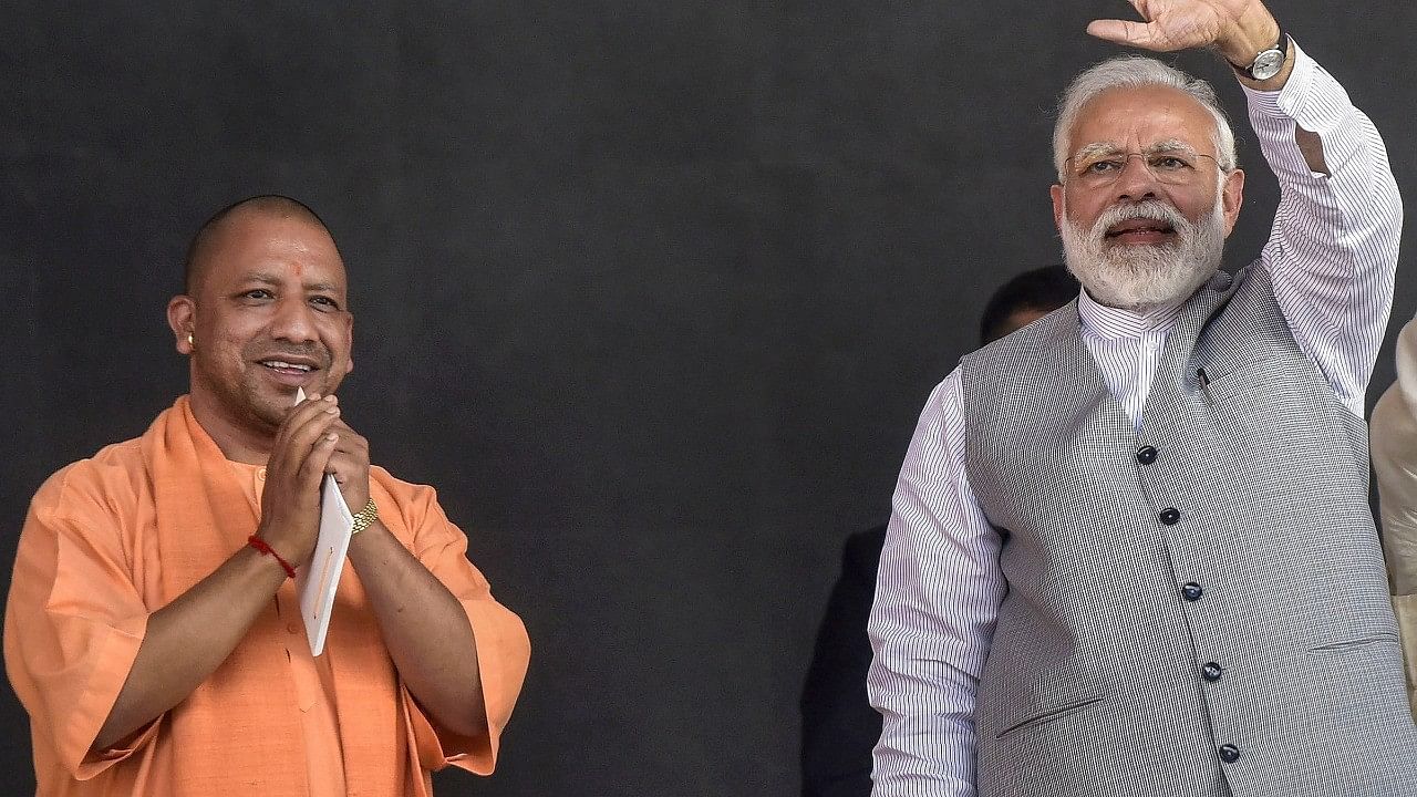 <div class="paragraphs"><p>UP Chief Minister Yogi Adityanath (L) alongside PM Narendra Modi. </p></div>