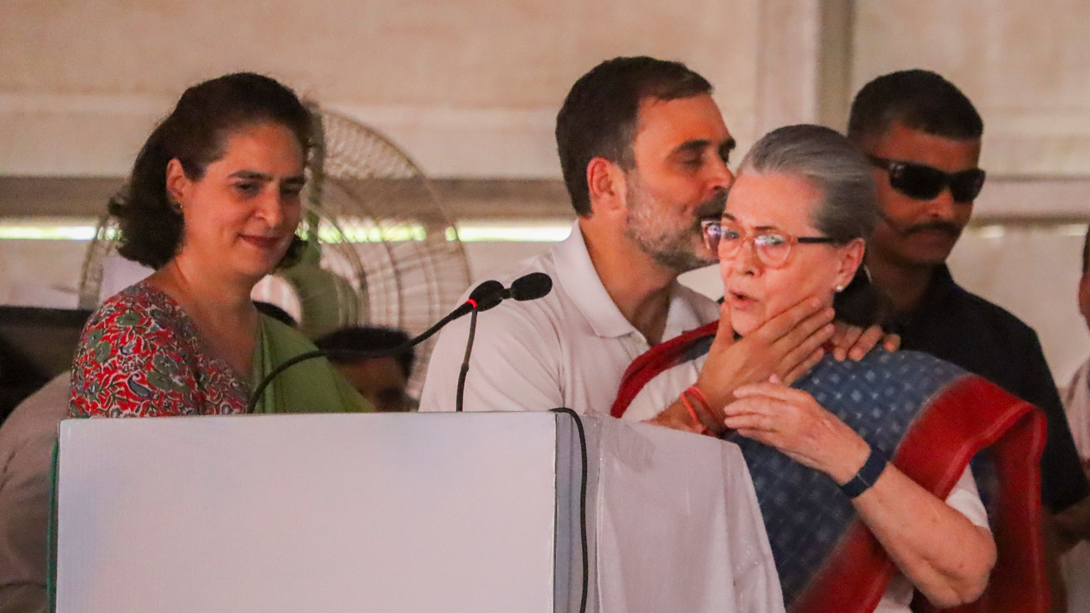 <div class="paragraphs"><p> Congress leader and party candidate from Rae Bareli constituency Rahul Gandhi greets his mother and party leader Sonia Gandhi during a public meeting for the Lok Sabha elections. Priyanka Gandhi can also be seen in the picture.</p></div>