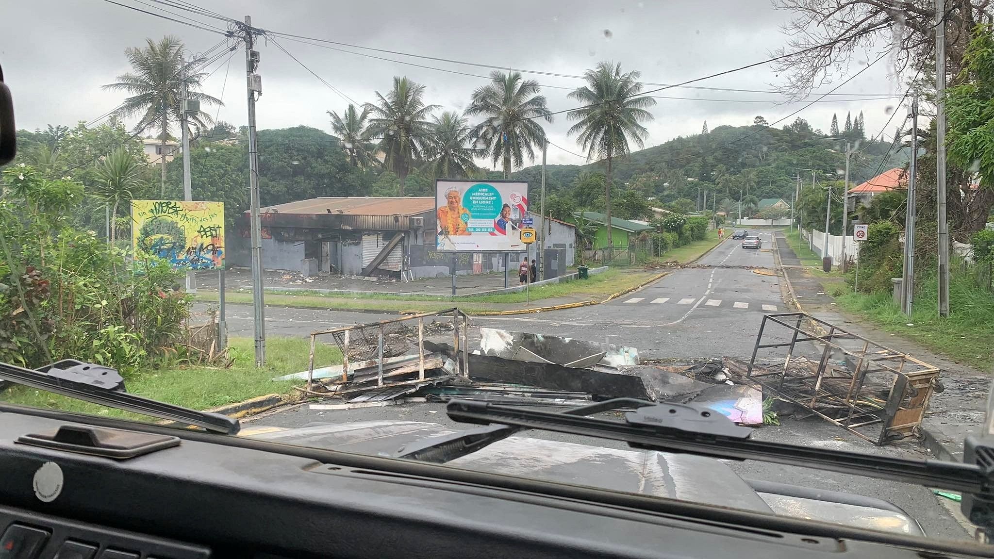 <div class="paragraphs"><p>A road is barricaded by rioters as they protest against plans to allow more people to take part in local elections in the French-ruled territory, which indigenous Kanak protesters reject, in Noumea, New Caledonia, May 15, 2024, in this picture obtained from social media. </p></div>