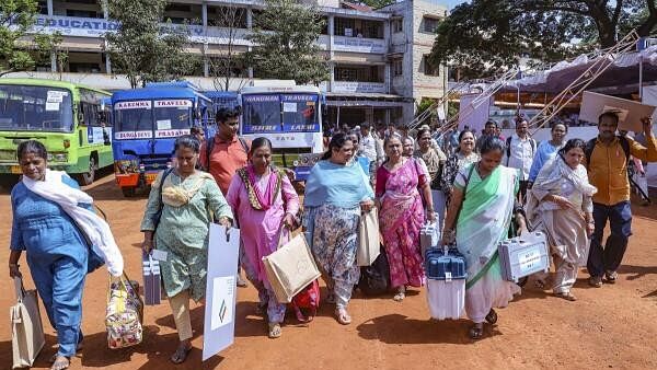 <div class="paragraphs"><p>Polling officials carrying election material leave for their respective polling booths, a day before the voting in the third phase of Lok Sabha elections.</p></div>