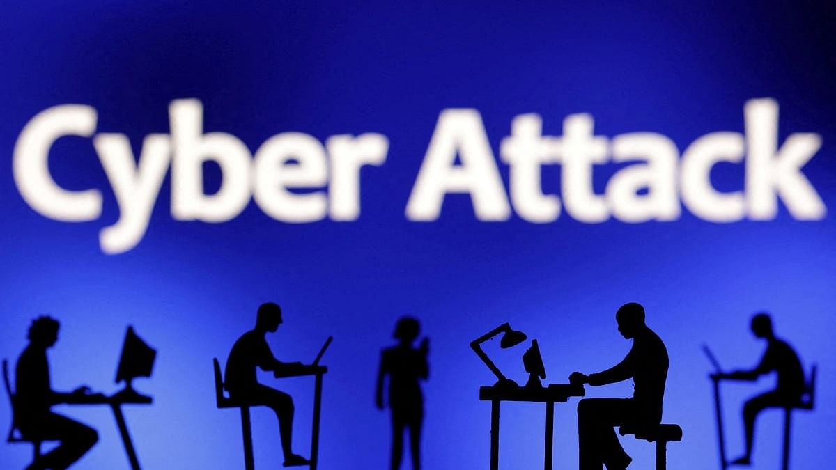 <div class="paragraphs"><p>Figurines with computers and smartphones are seen in front of the words "Cyber Attack" in this illustration </p></div>