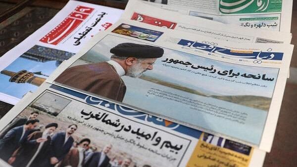 <div class="paragraphs"><p>A newspaper with a picture of the late Iran's President Ebrahim Raisi is seen in Tehran.</p></div>