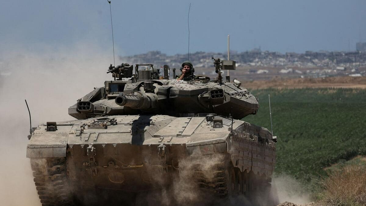 <div class="paragraphs"><p>An Israeli tank manoeuvres near the Israel-Gaza border, amid the ongoing conflict between Israel and the Palestinian Islamist group Hamas, in Israel, May 16, 2024. </p></div>