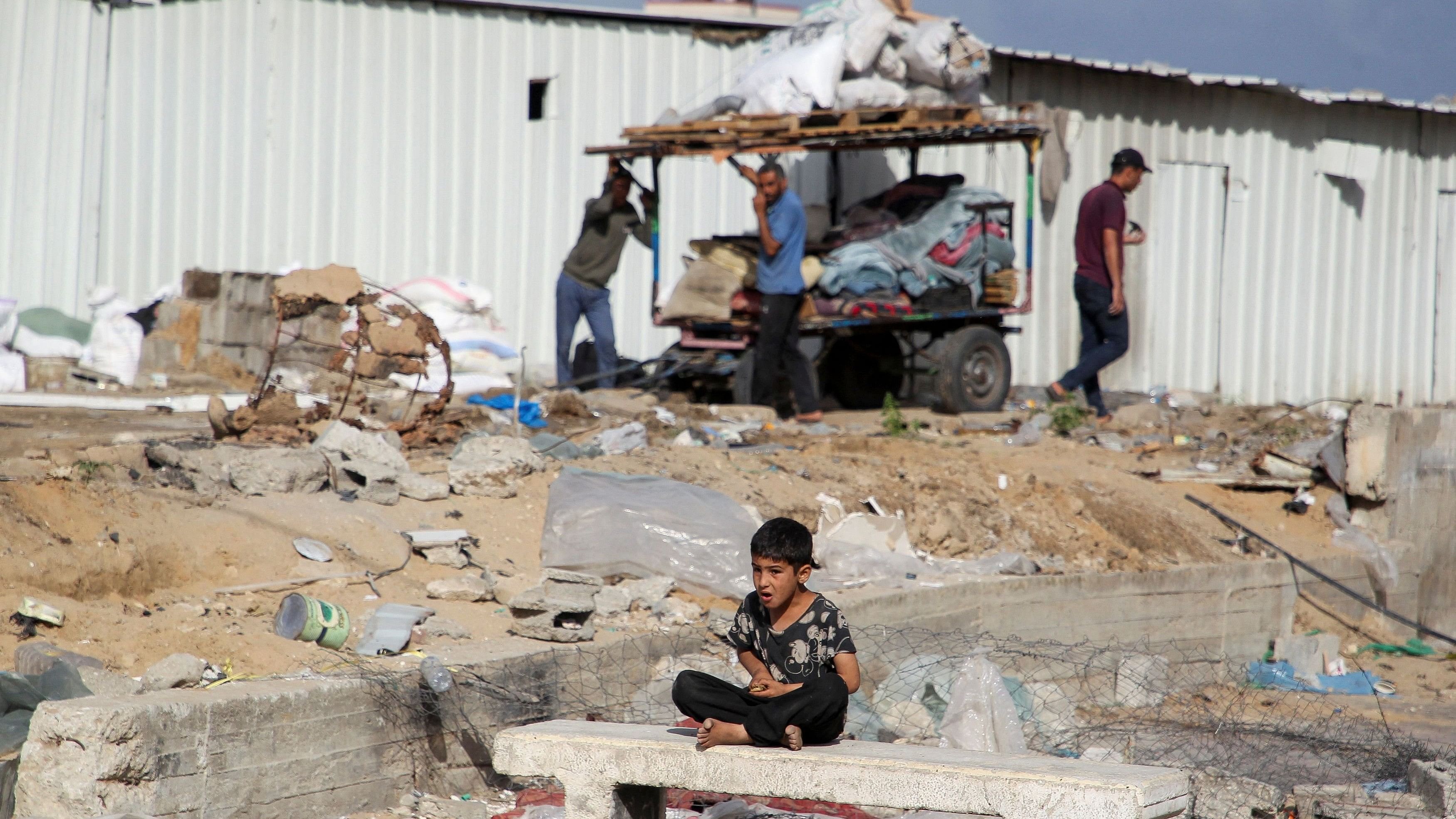 <div class="paragraphs"><p>A boy looks on as Palestinians prepare to flee Rafah after Israeli forces launched a ground and air operation in the eastern part of the southern Gaza city.</p></div>