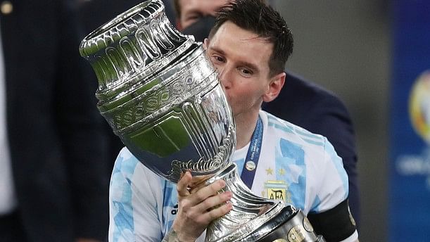 <div class="paragraphs"><p>Lionel Messi kisses the Copa America trophy following Argentina's 1-0 win over Brazil in final of the 2021 edition.</p></div>