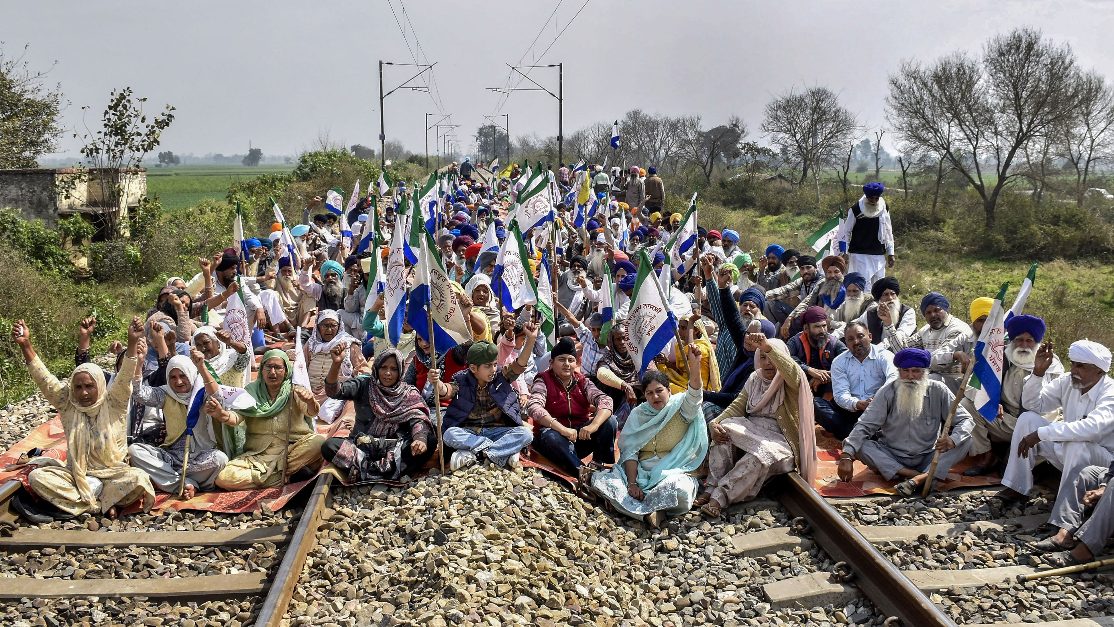 <div class="paragraphs"><p> Farmers block railway tracks during their 'rail roko' protest.</p></div>