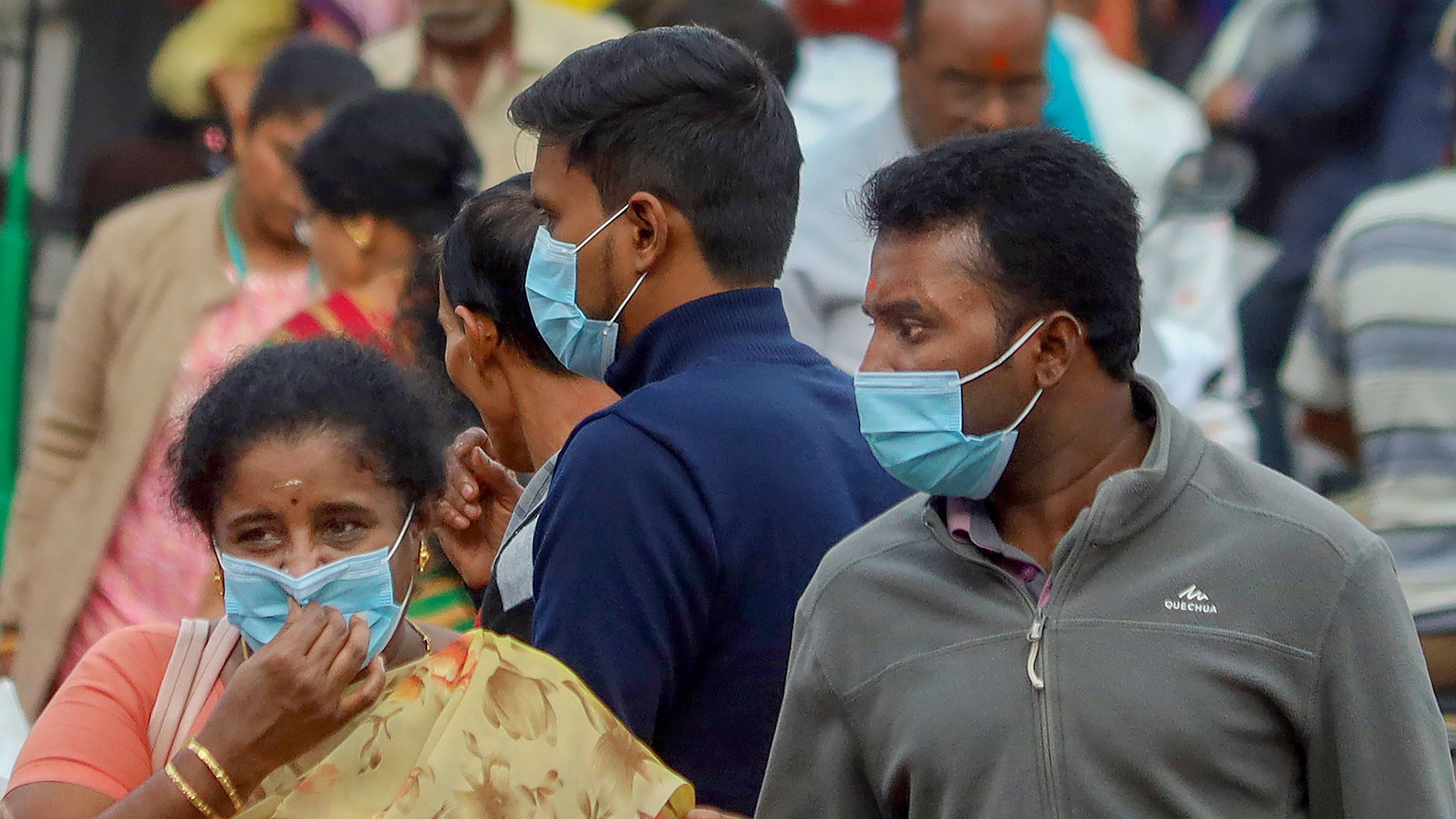 <div class="paragraphs"><p>Bengaluru: People wearing face masks as a precautionary measur</p></div>