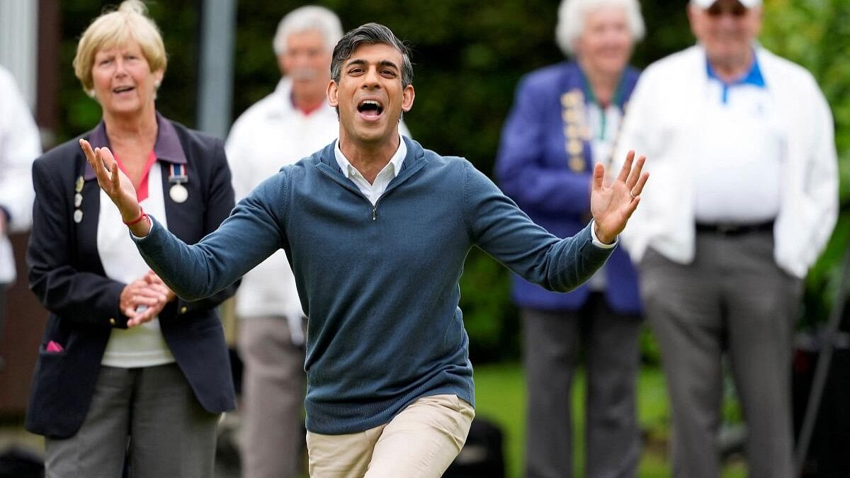 <div class="paragraphs"><p>Britain's Prime Minister Rishi Sunak reacts after bowling during a Conservative general election campaign event at the Market Bosworth Bowls Club in Market Bosworth, Britain.</p></div>