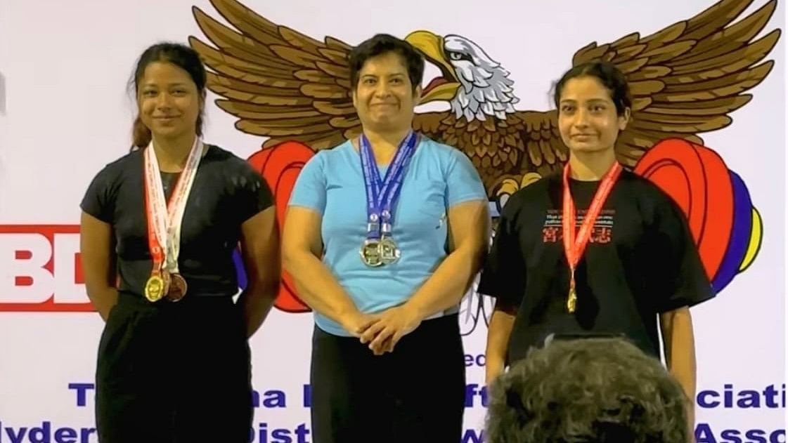 <div class="paragraphs"><p>Deepa Ajay (centre) with her gold medal at the National Senior Women</p></div>