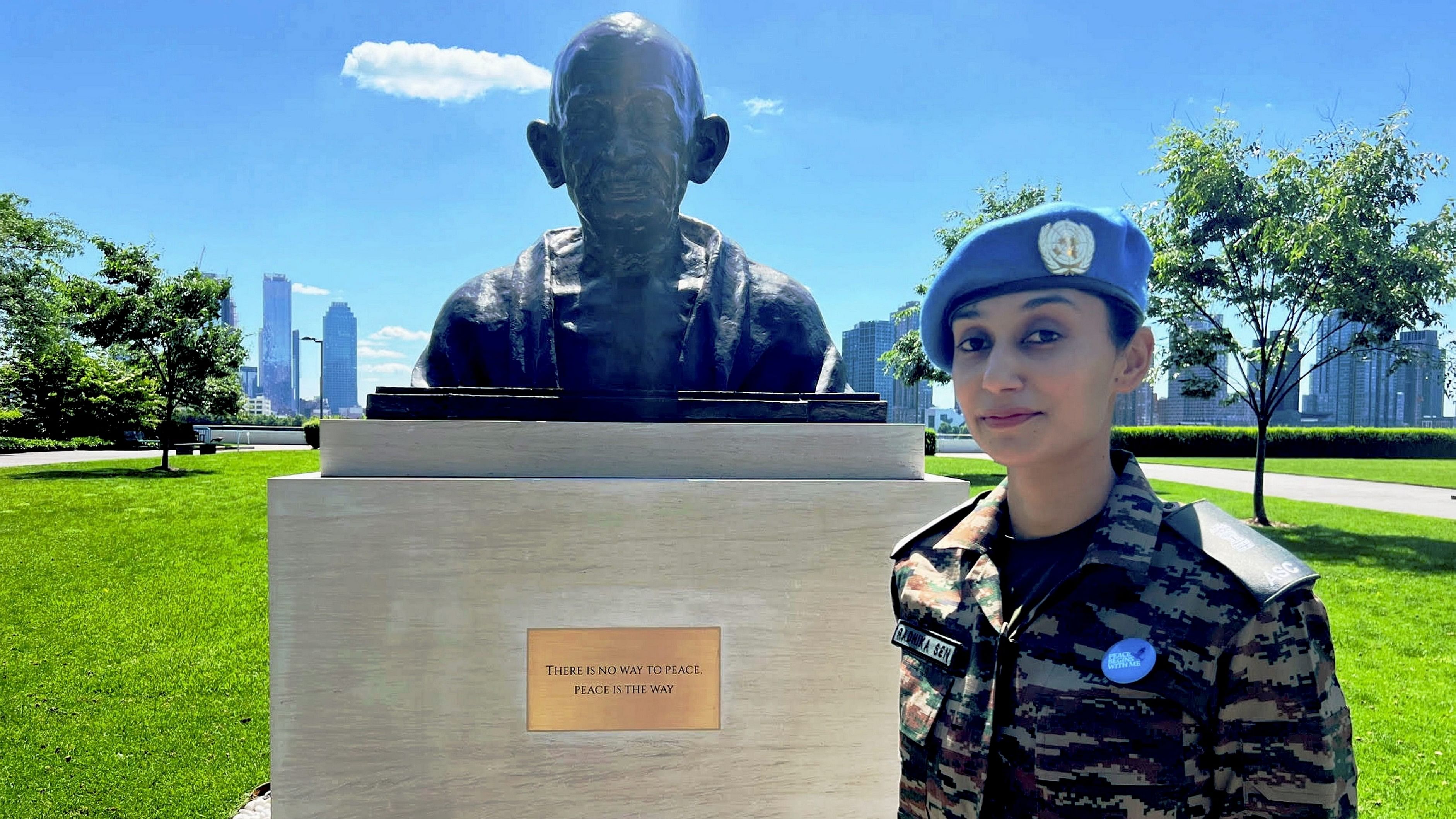 <div class="paragraphs"><p>Major Radhika Sen of India stands near the Gandhi Statue at UN Headquarters. </p></div>