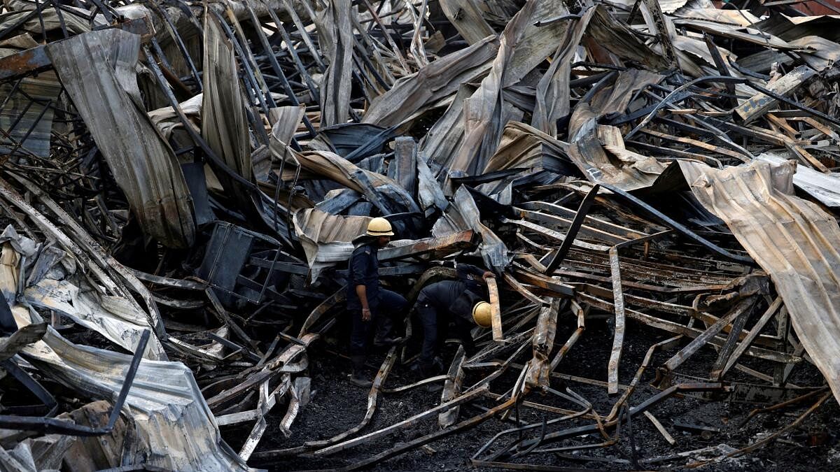 <div class="paragraphs"><p>Firefighters search for victims amidst the debris following a fire in a gaming zone in Rajkot, in the western state of Gujarat, India, May 26, 2024.</p></div>