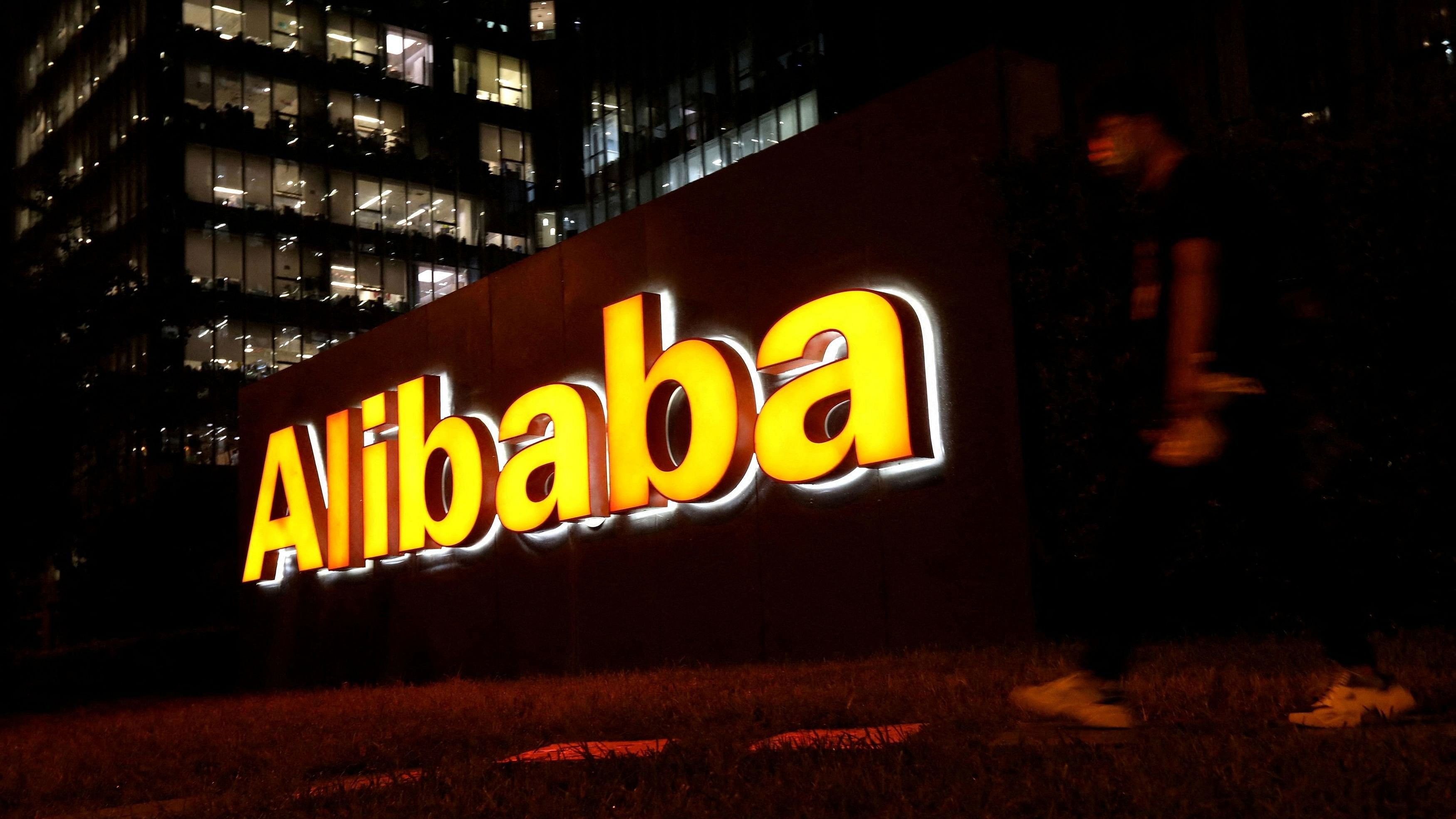 <div class="paragraphs"><p>A man walks past Alibaba Group's logo at its office building in Beijing, China.&nbsp;</p></div>