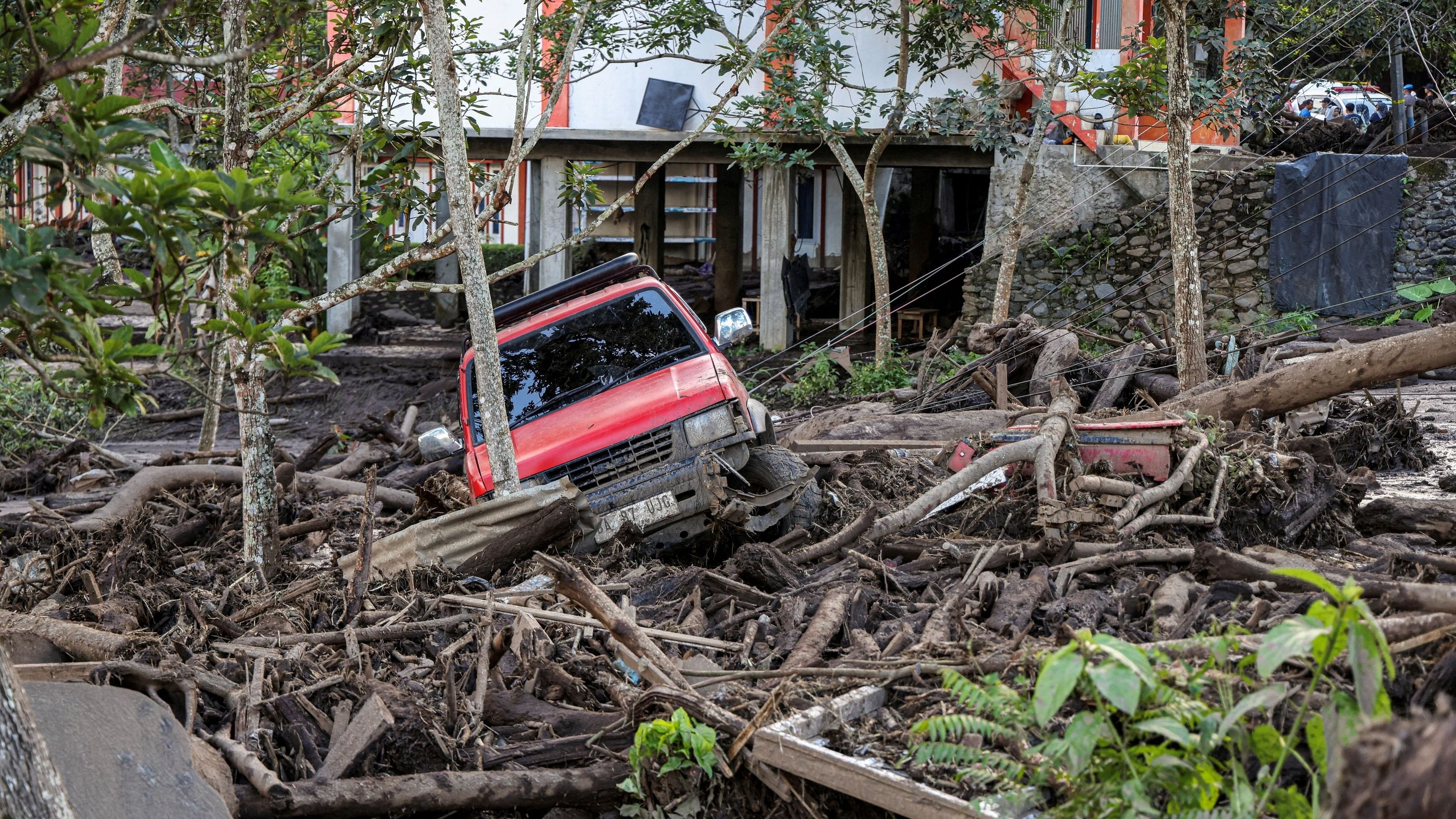 <div class="paragraphs"><p>A damaged car is seen in an area affected by heavy rain brought flash floods and landslides in Tanah Datar, West Sumatra province, Indonesia, May 12, 2024, in this photo taken by Antara Foto.  </p></div>