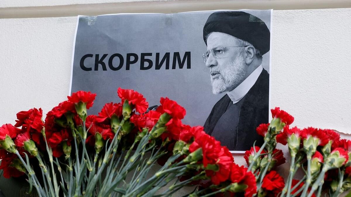 <div class="paragraphs"><p>A view shows flowers outside the Iranian embassy placed to pay tribute to Iran's President Ebrahim Raisi, Foreign Minister Hossein Amirabdollahian and other victims of a recent helicopter crash in mountainous terrain near Iran's border with Azerbaijan, in Moscow, Russia, May 20, 2024. A placard with a portrait of Iran's President Ebrahim Raisi reads: "We mourn". </p></div>