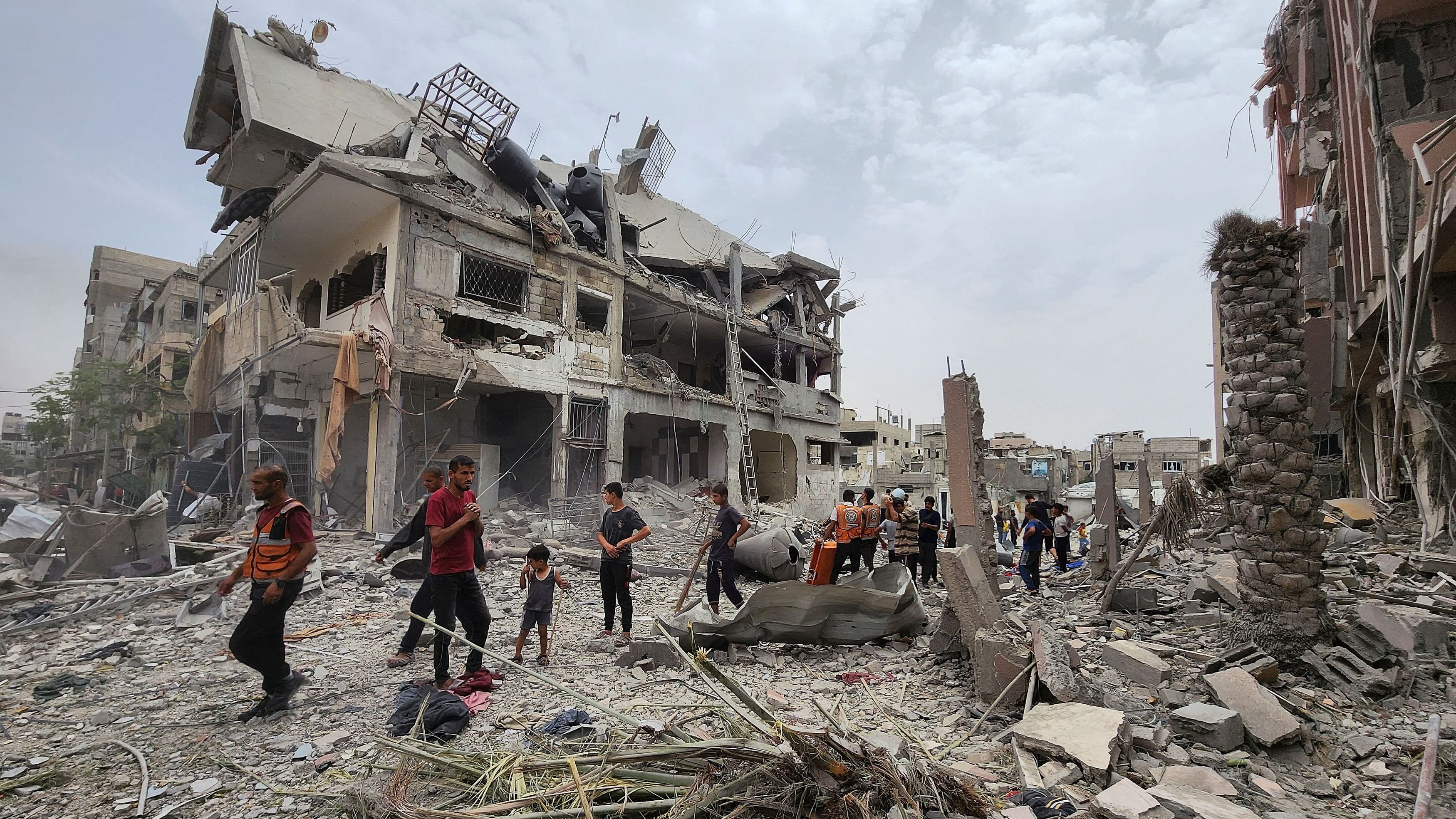 <div class="paragraphs"><p>Palestinians inspect the site of an Israeli strike on a house, amid the ongoing conflict between Israel and the Palestinian Islamist group Hamas, in Beit Lahia, in the northern Gaza Strip, May 20, 2024. </p></div>