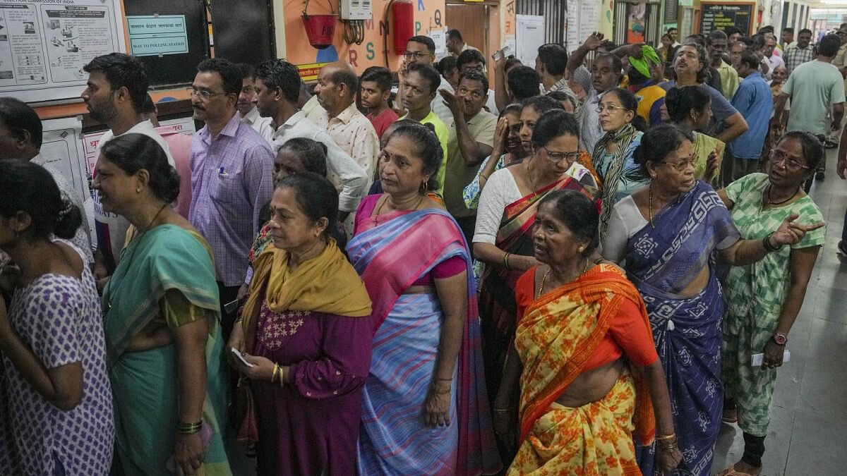 <div class="paragraphs"><p>People wait to cast their votes in Mumbai on Monday, May 20,.</p></div>