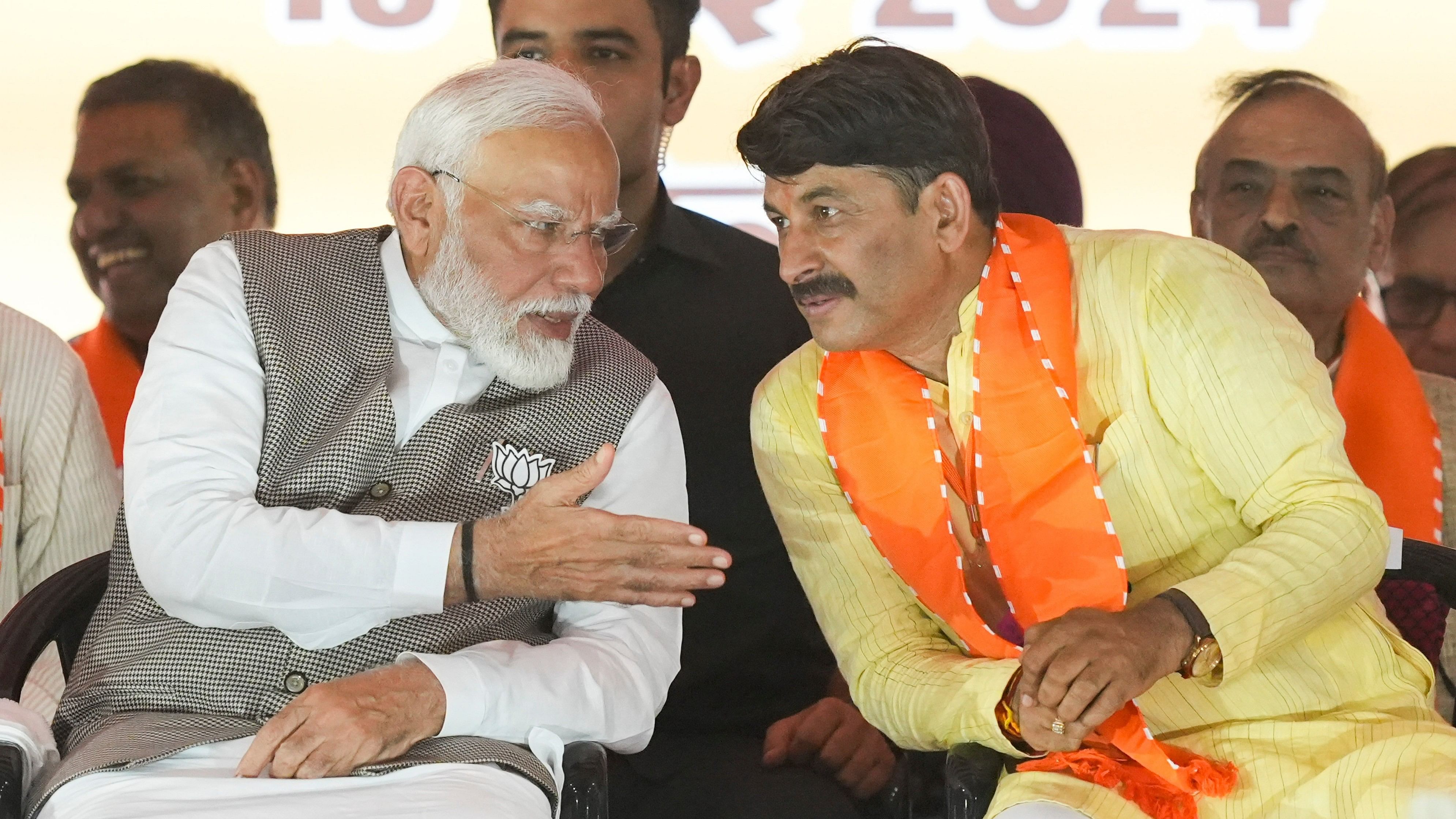 <div class="paragraphs"><p>New Delhi: Prime Minister and senior BJP leader Narendra Modi with party candidate Manoj Tiwari during a rally for Lok Sabha elections, at Kartar Nagar in New Delhi, Saturday, May 18, 2024. </p></div>