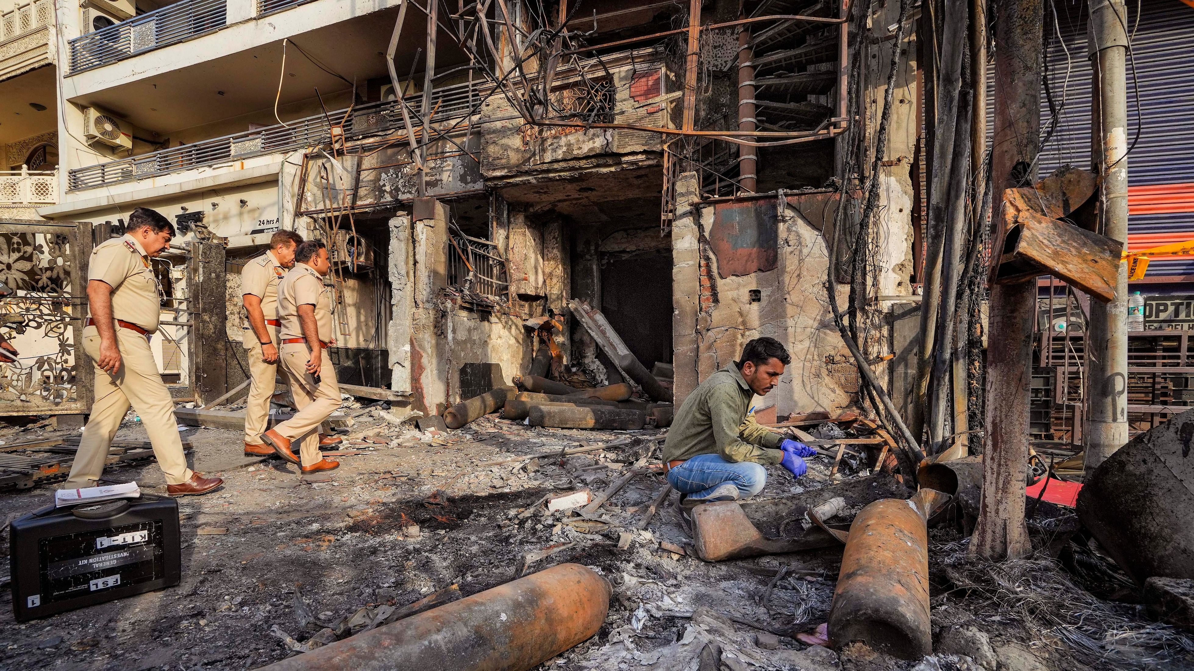 <div class="paragraphs"><p>A forensic expert collects samples from site of the fire at the New Born Baby Care Hospital, in east Delhi, Sunday, May 26, 2024</p></div>