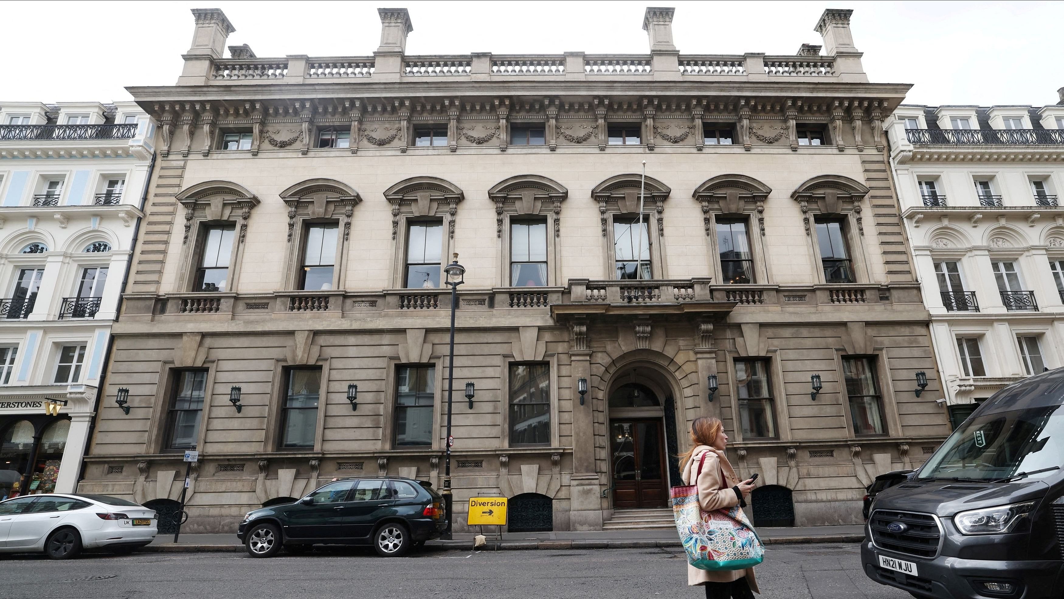 <div class="paragraphs"><p> A person walks past the entrance to the Garrick Club, a private member's club in London, Britain.</p></div>