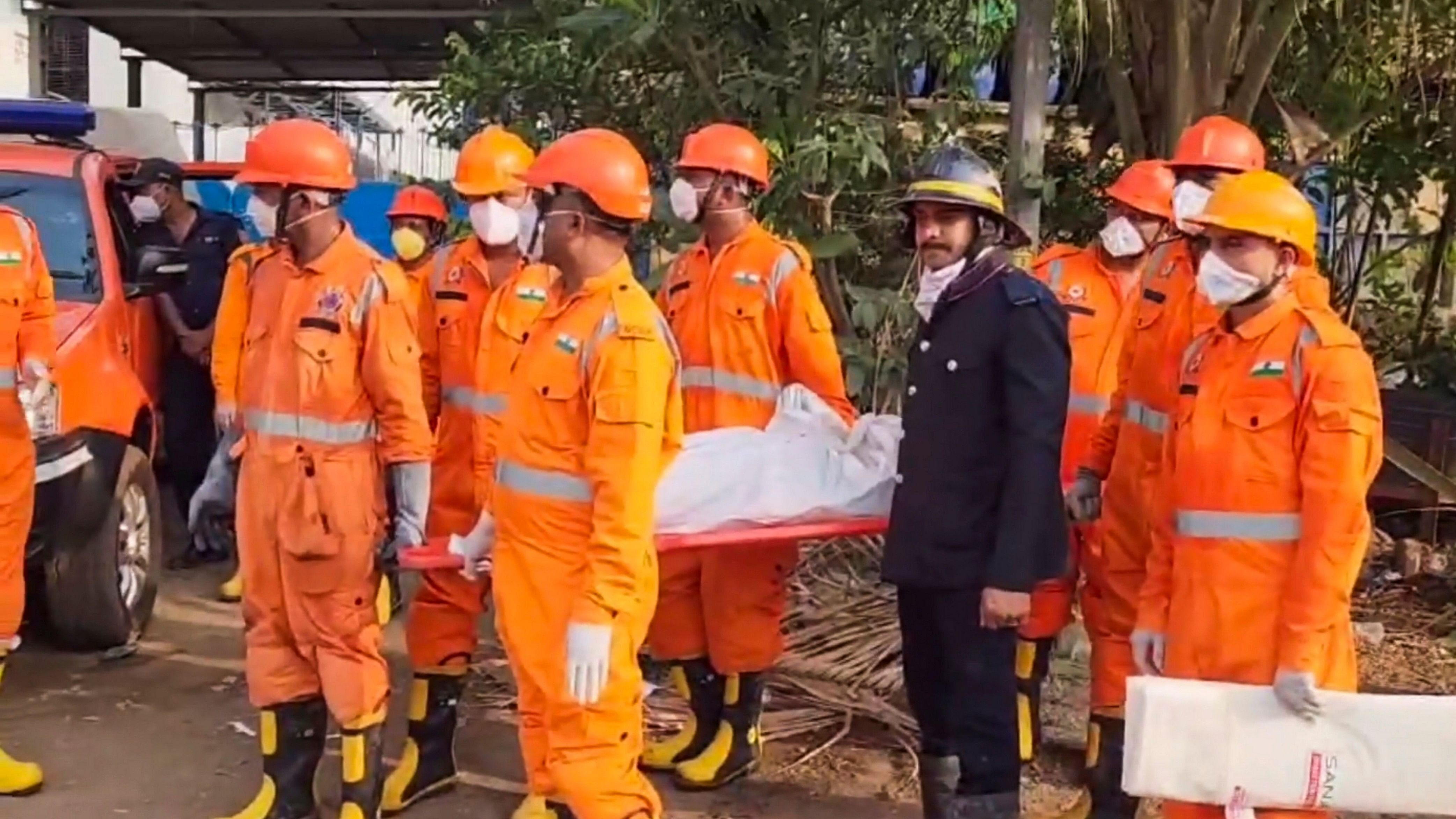 <div class="paragraphs"><p> Officials carry a body as the death toll in the chemical factory blast rises to nine with the discovery of one more body from the accident site at Dombivli, in Thane district, Friday, May 24, 2024. </p></div>