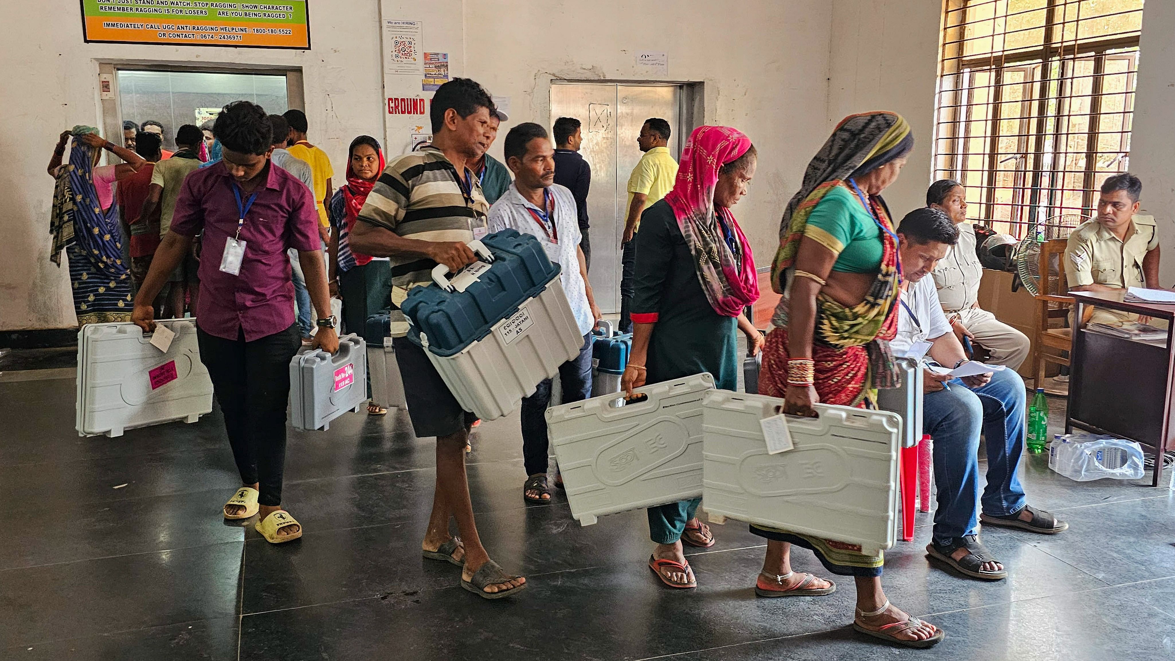 <div class="paragraphs"><p>Polling officials and workers with EVMs and other election material at a distribution centre before leaving for their respective polling booths, ahead of the sixth phase of Lok Sabha elections, in Bhubaneswar, Thursday, May 23, 2024.</p></div>