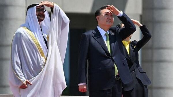 <div class="paragraphs"><p>United Arab Emirates President Sheikh Mohamed bin Zayed Al Nahyan, South Korean President Yoon Suk Yeol and his wife Kim Keon Hee watch the Black Eagles, the aerobatic team of T-50 jets belonging to South Korea's air force, during a welcoming ceremony at the Presidential Office in Seoul on May 29, 2024.</p></div>