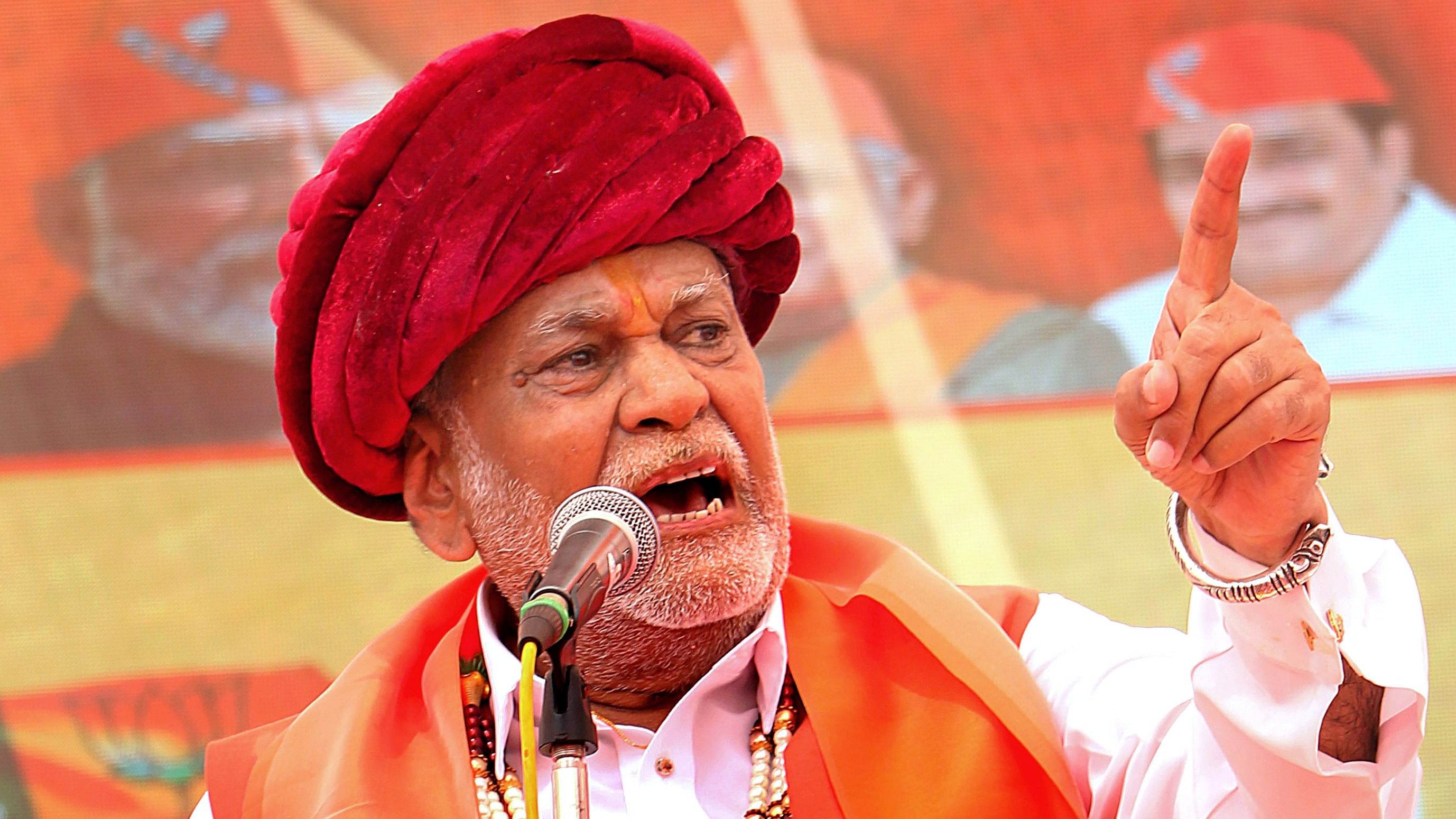 <div class="paragraphs"><p>Parshottam Rupala addresses a gathering as he arrives to file his nomination papers for Lok Sabha elections, in Rajkot</p></div>