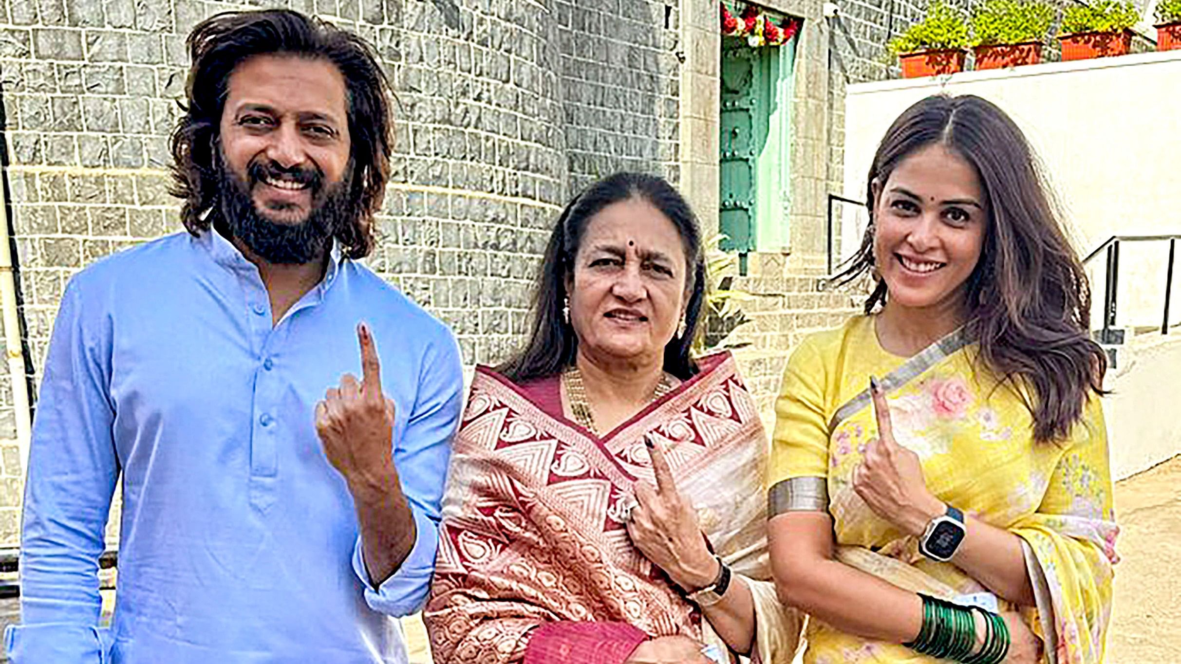 <div class="paragraphs"><p>Actor Riteish Deshmukh with mother Vaishali Deshmukh and wife Genelia D'souza (R) shows their ink-marked finger after casting vote for Lok Sabha elections, in Latur, on Tuesday.</p></div>