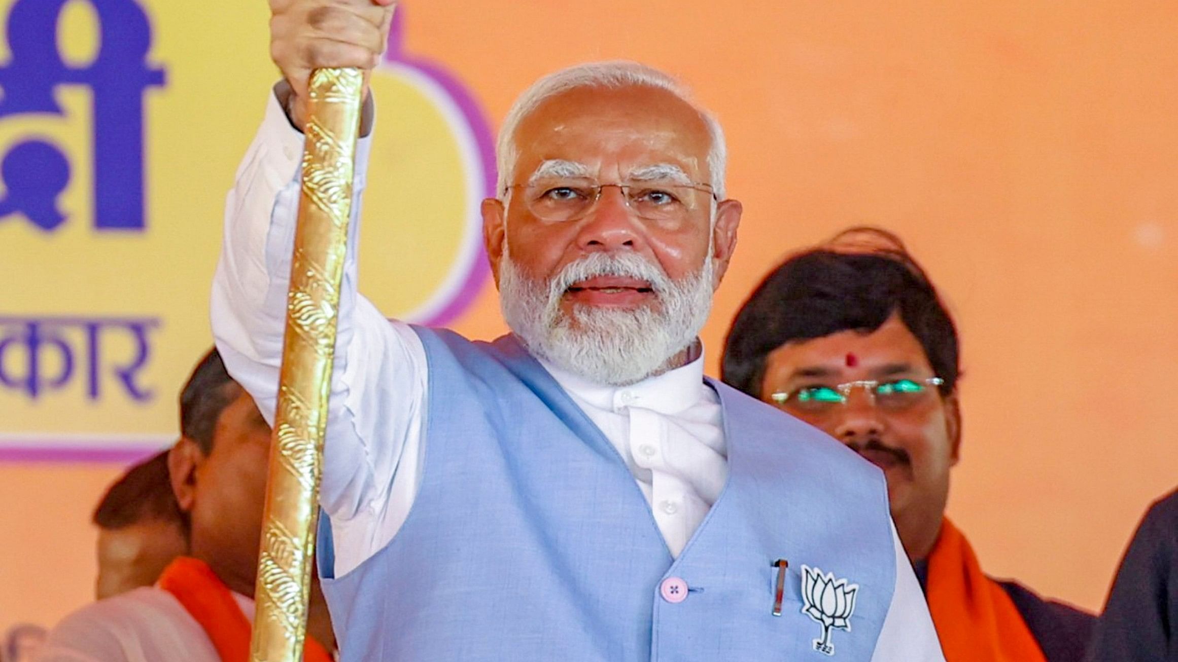 <div class="paragraphs"><p>rime Minister Narendra Modi holds a trident during a public meeting for Lok Sabha elections, in Barabanki, Uttar Pradesh, on Friday.</p></div>