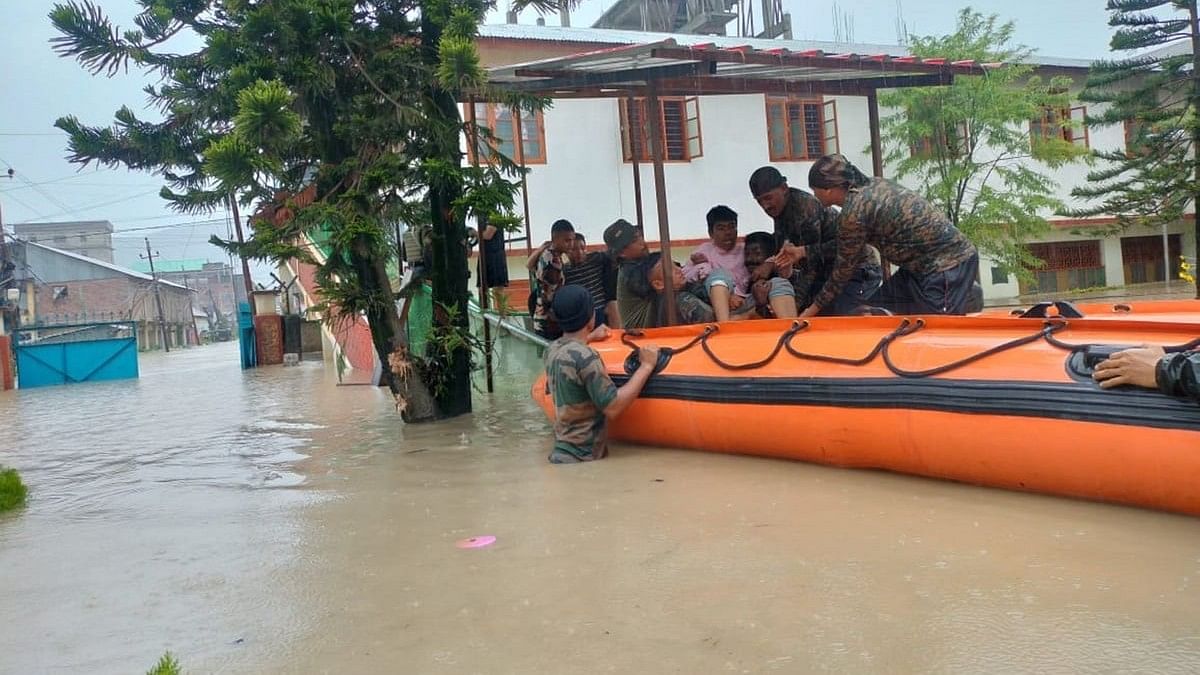 <div class="paragraphs"><p> Imphal: Assam Rifles personnel with others during a rescue and relief operation Jaltarang at a flood-affected area in the aftermath of cyclone Remal, in Imphal city. </p></div>