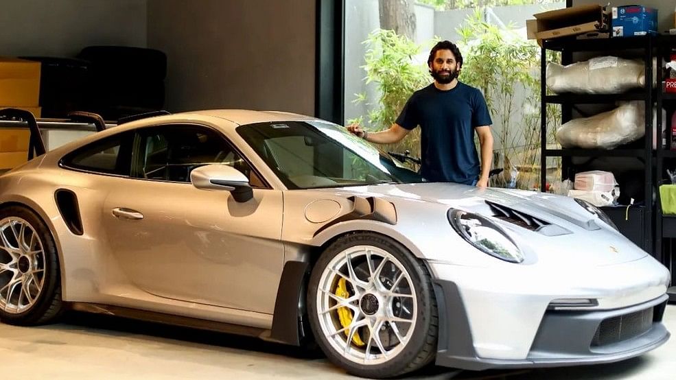 <div class="paragraphs"><p>Naga Chaitanya poses with his Porsche 911 Gt3 Rs.</p></div>