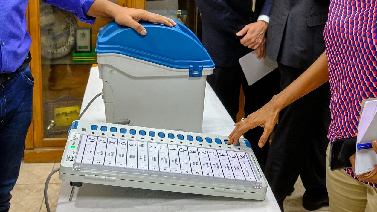 <div class="paragraphs"><p>Representative image showing people voting at the EVM machine.</p></div>