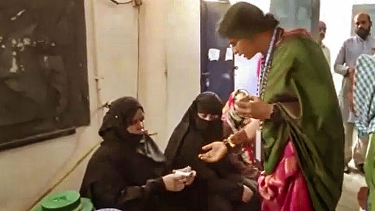 <div class="paragraphs"><p>BJP candidate Madhavi Latha checks identity of voters at a polling station during the fourth phase of Lok Sabha elections, in Hyderabad</p></div>