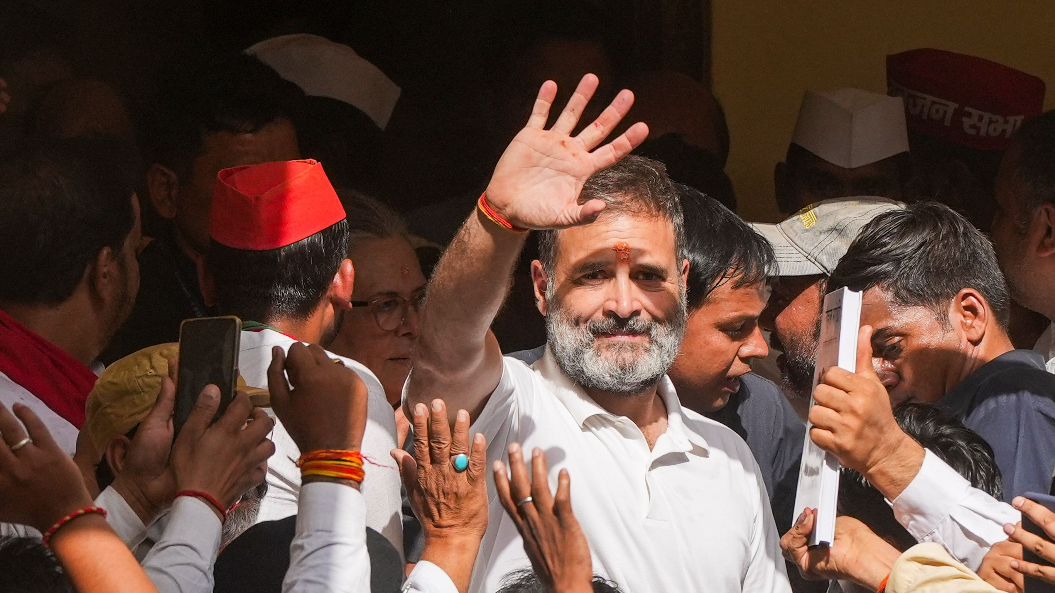 <div class="paragraphs"><p>Congress leader and candidate from Raebareli constituency Rahul Gandhi waves to supporters after performing havan for the Lok Sabha elections, in Raebareli, Friday, May 3, 2024. </p></div>