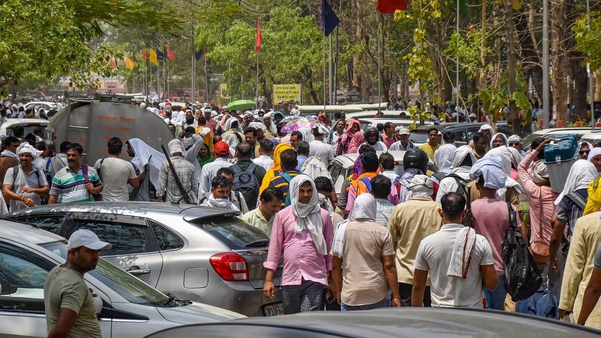 <div class="paragraphs"><p>Polling officials leave for their respective polling stations after collecting EVMs and other election materials on the eve of the seventh phase of Lok Sabha polls.</p></div>