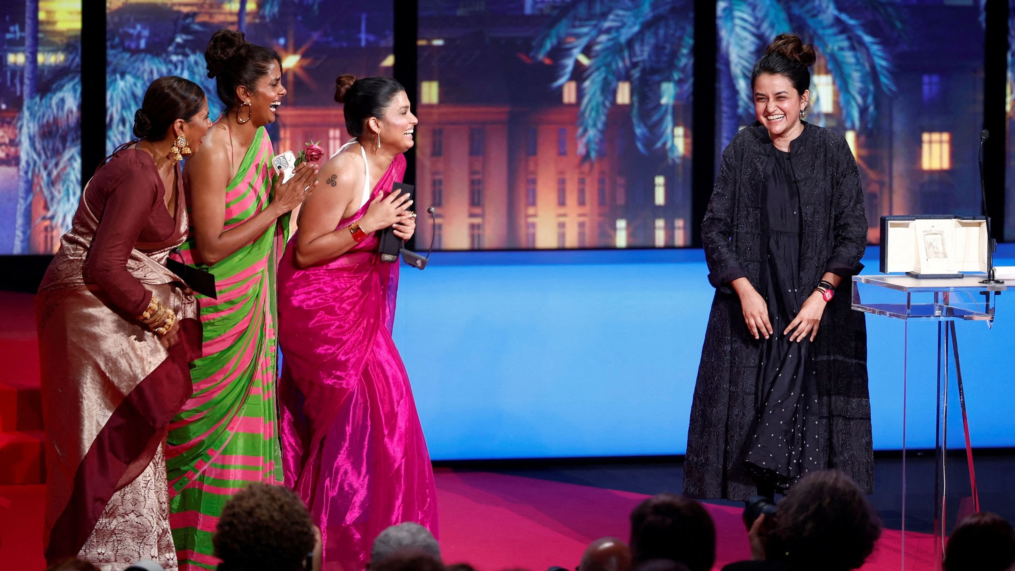 <div class="paragraphs"><p>Director Payal Kapadia, Grand Prix award winner for the film "All We Imagine as Light", reacts next to cast members during the closing ceremony of the 77th Cannes Film Festival in Cannes, France, May 25, 2024. </p></div>