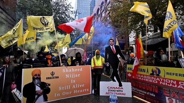 <div class="paragraphs"><p>Flags and signs are seen as demonstrators protest outside India's consulate, after Canada's Prime Minister Justin Trudeau raised the prospect of New Delhi's involvement in the murder of Sikh separatist leader Hardeep Singh Nijjar</p></div>