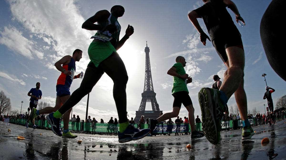 <div class="paragraphs"><p>Runners make their way past the Eiffel Tower as they participate in the 42nd Paris Marathon, in France.</p></div>